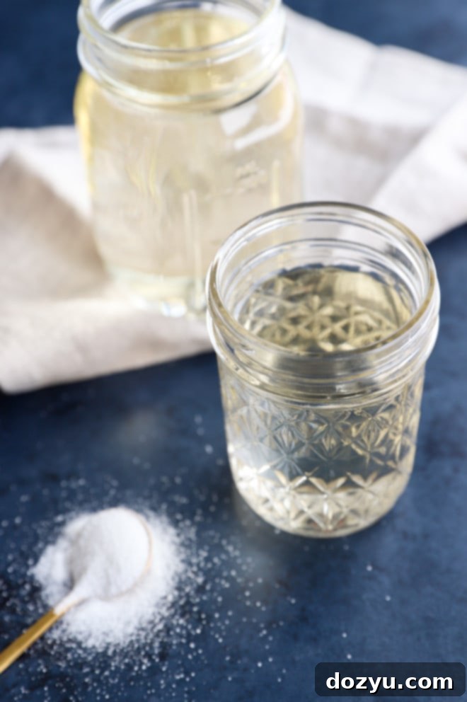 Easy Homemade Simple Syrup 8 Picture of sugar liquid in jars