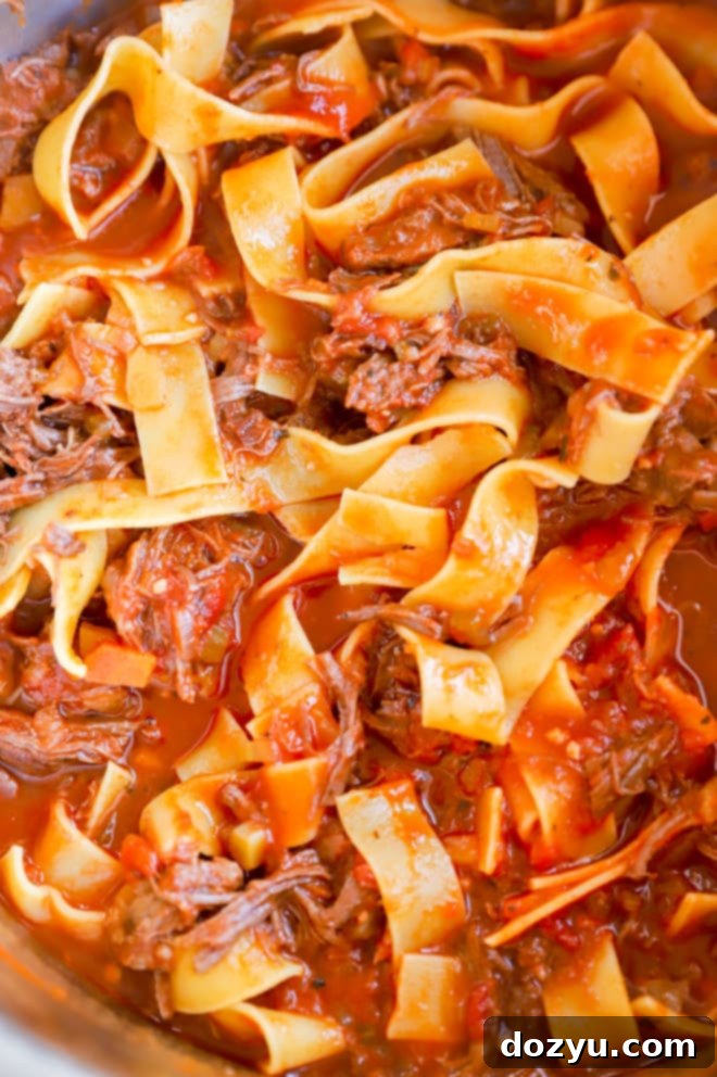 Fall-Off-The-Bone Instant Pot Short Rib Ragu 3 Close-up shot of raw beef short ribs being seared in an Instant Pot, developing a rich brown crust.