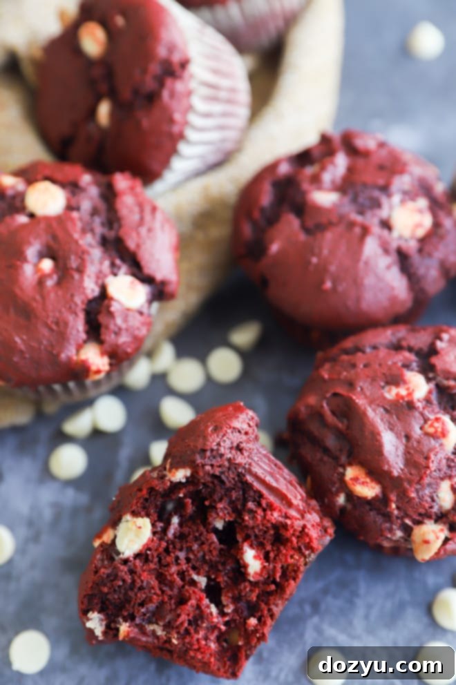 Crimson Velvet Indulgence 8 Close-up of a stack of Red Velvet Muffins, ready to be devoured.