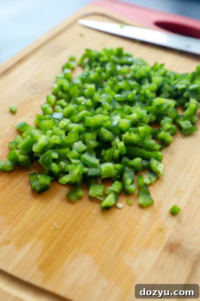 Master Jalapeno Seeding 8 A vibrant close-up of a finished dish featuring jalapeños, possibly a dip or stuffed pepper creation, tempting for any foodie