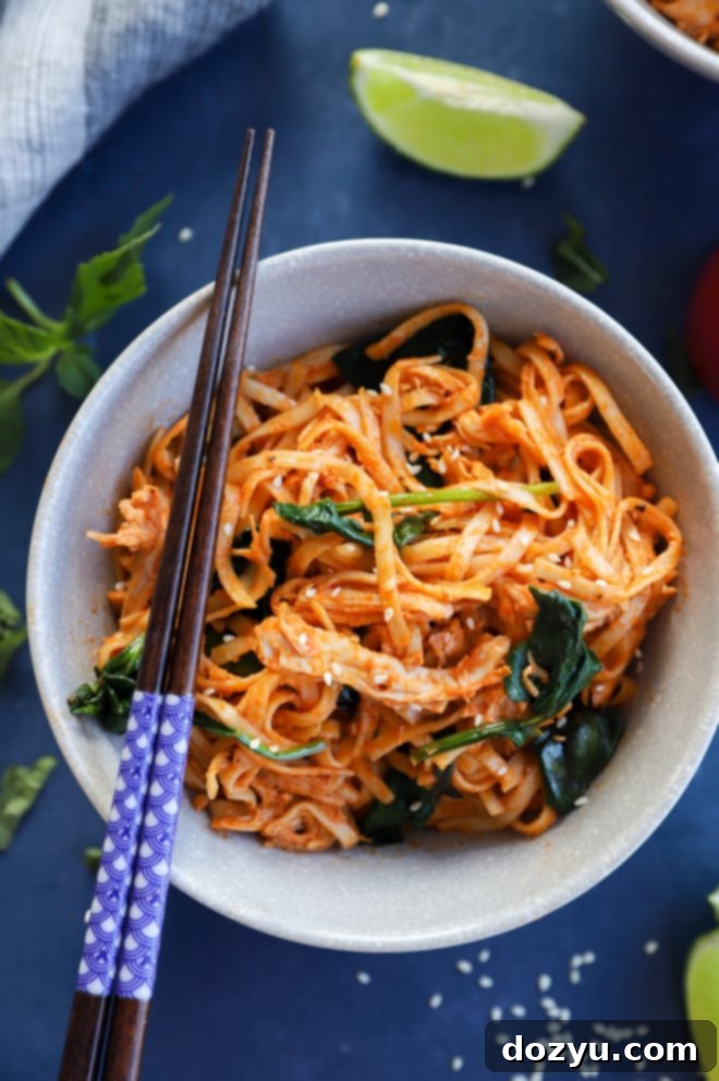 Zesty Gochujang Chicken Noodles 7 Gochujang Noodles with Chicken and Spinach in a bowl with chopsticks