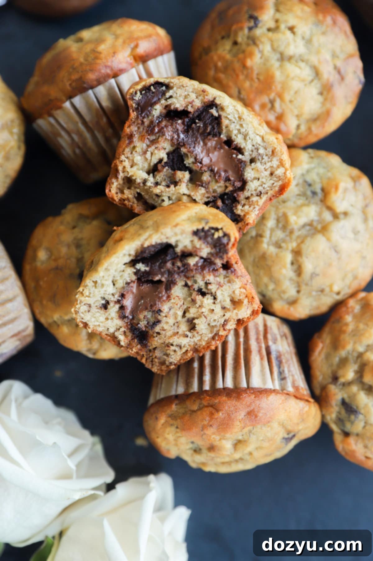 Decadent One-Bowl Banana Nutella Muffins 10 Muffin sliced in half with Nutella in the center