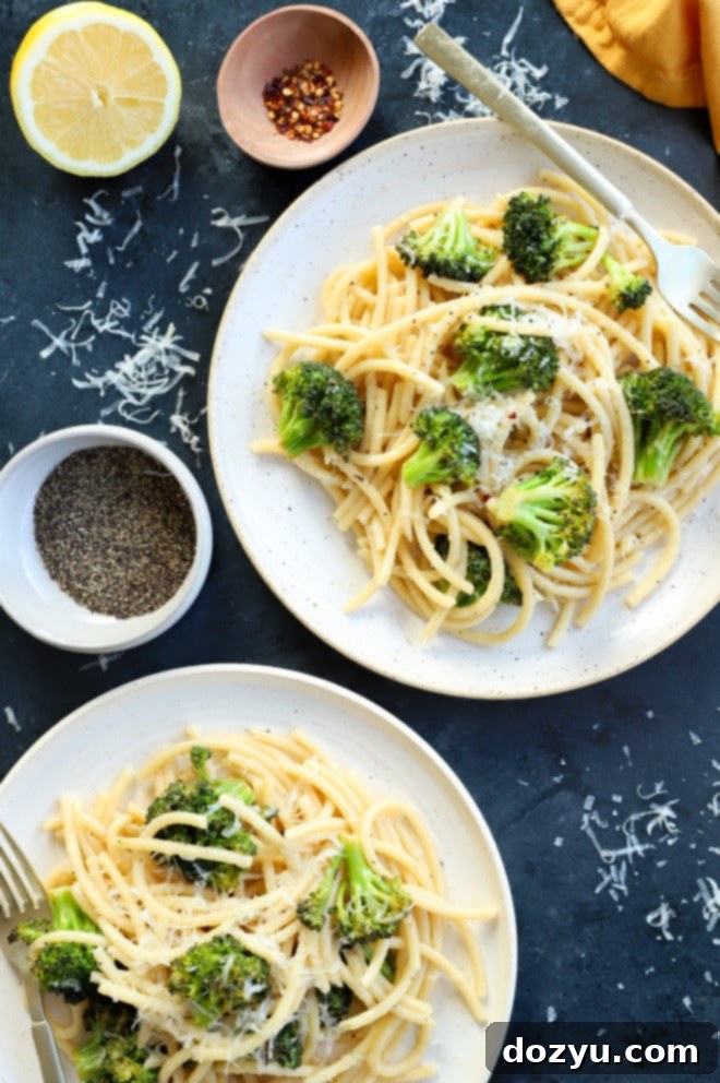 Vibrant Bucatini Cacio e Pepe with Broccoli 2 Bucatini cacio e pepe on plates with broccoli image