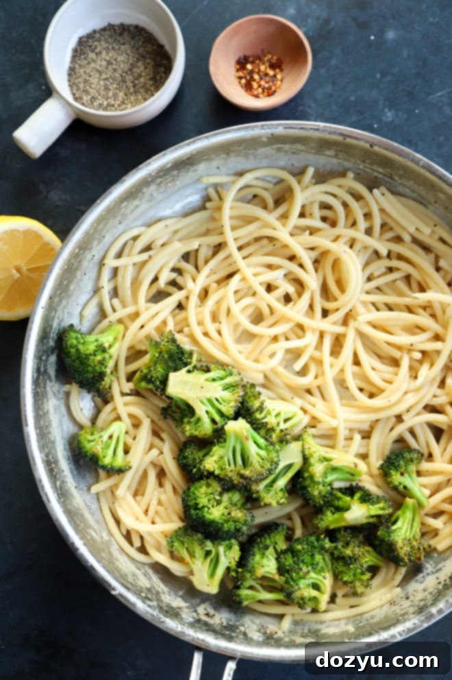 Vibrant Bucatini Cacio e Pepe with Broccoli 5 Image of pasta with broccoli in skillet