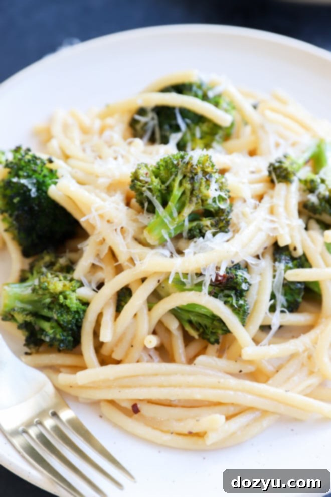 Vibrant Bucatini Cacio e Pepe with Broccoli 6 Easy weeknight pasta with broccoli on plate with fork image