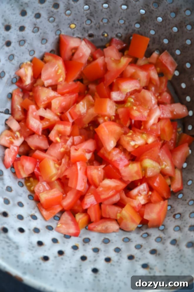 Caprese Bruschetta 5 Image of tomatoes draining in a colander