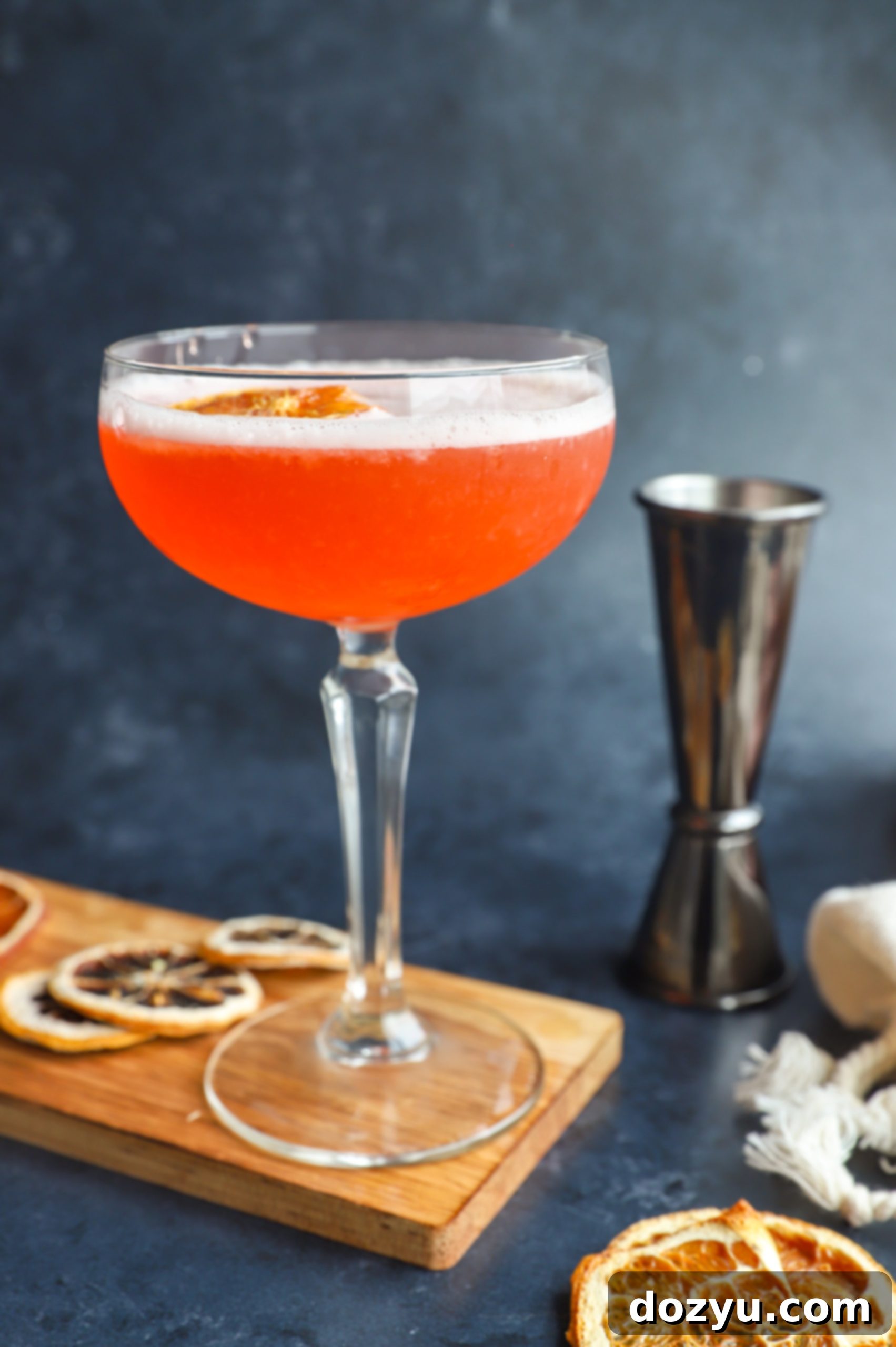Tangy Aperol Sour 6 Side angle of cocktail pink in coupe glass photo