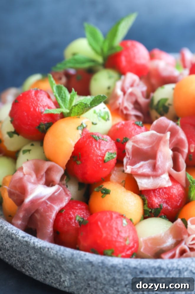 Sweet and Salty Melon Prosciutto Salad 11 Picture of fruit salad with herb dressing on platter