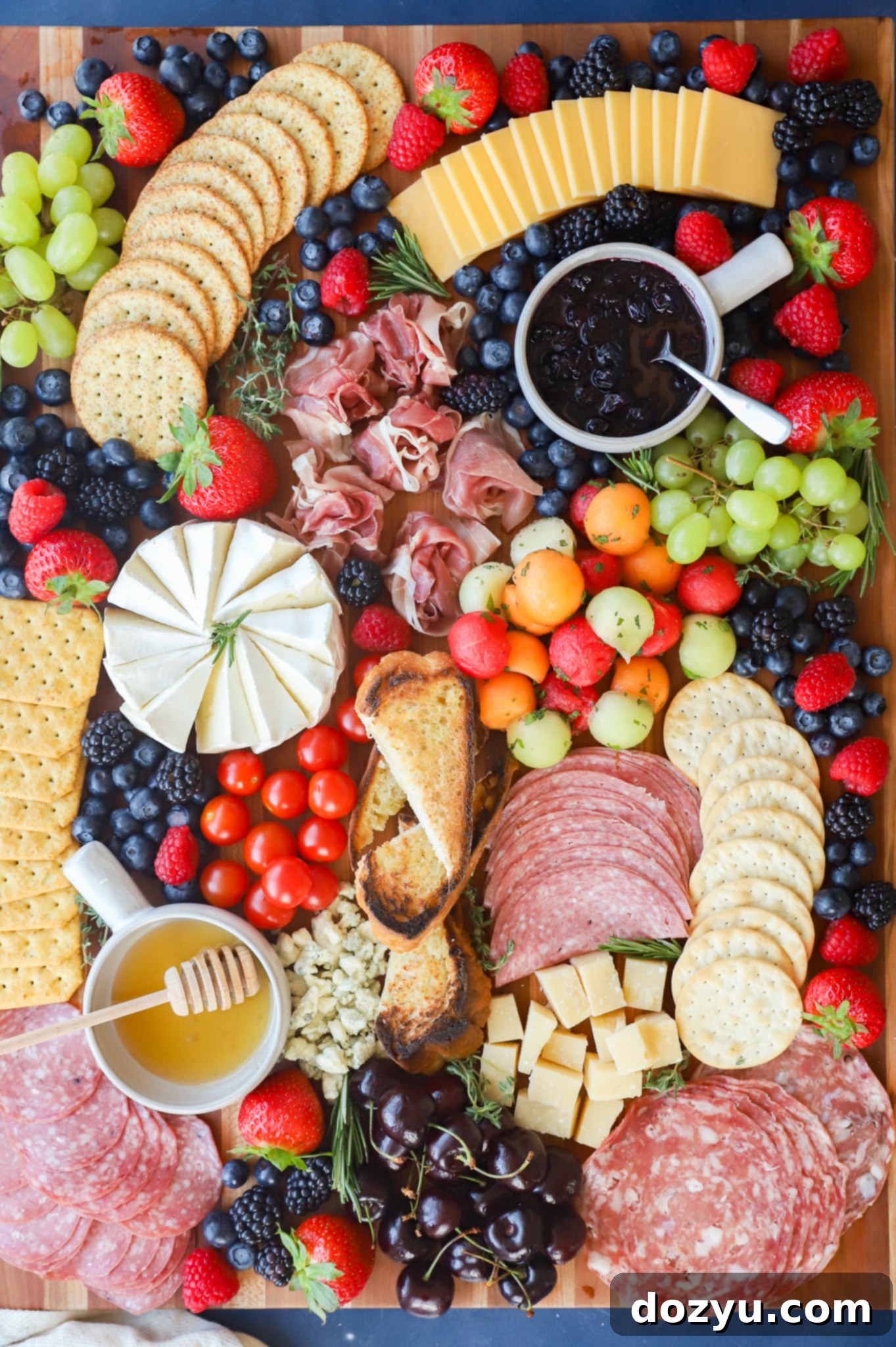 Effortless Summer Grazing Board 2 Vibrant seasonal spread of meats, cheeses, and fruits for a summer charcuterie board
