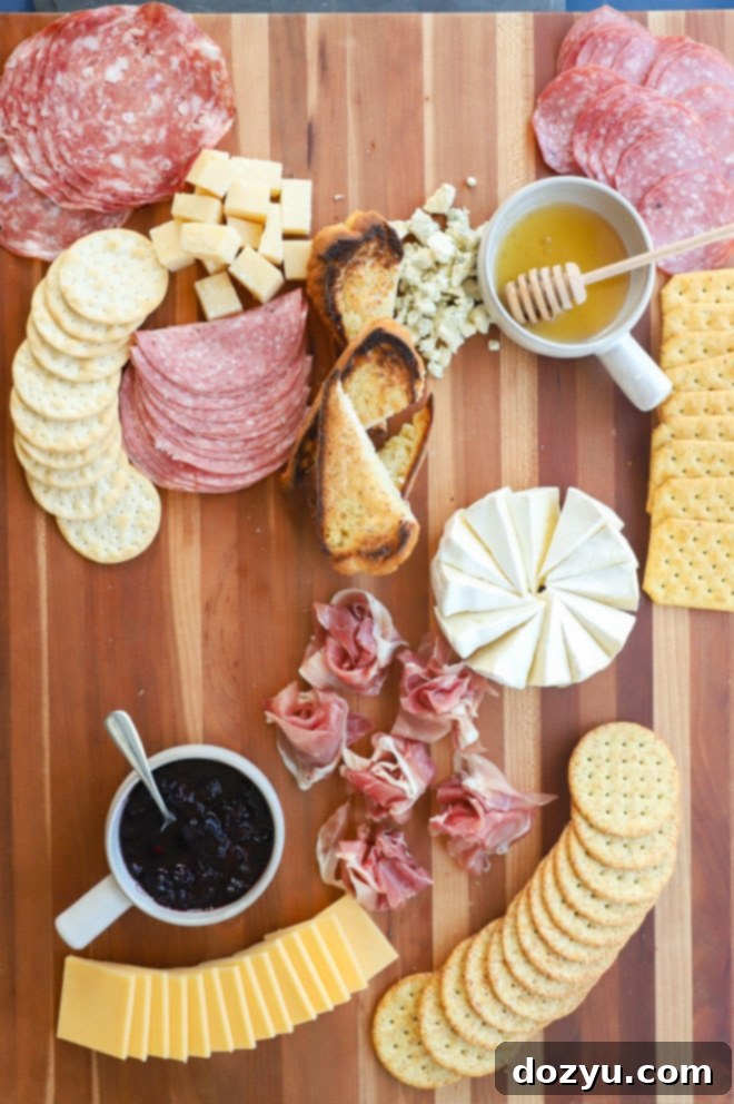 Effortless Summer Grazing Board 6 Putting together an appetizer spread with meat and cheese, step 2