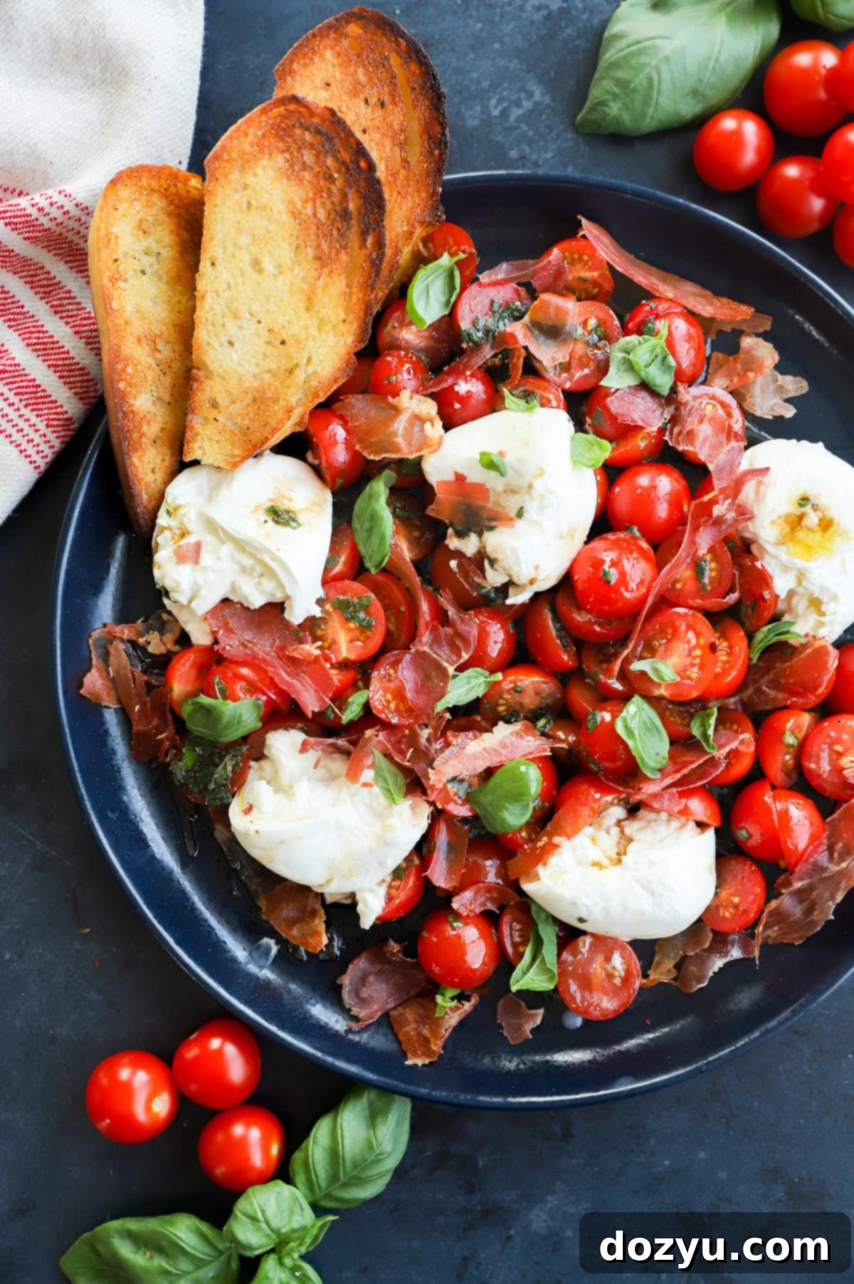 Creamy Burrata Caprese Salad 9 Burrata caprese salad image on platter