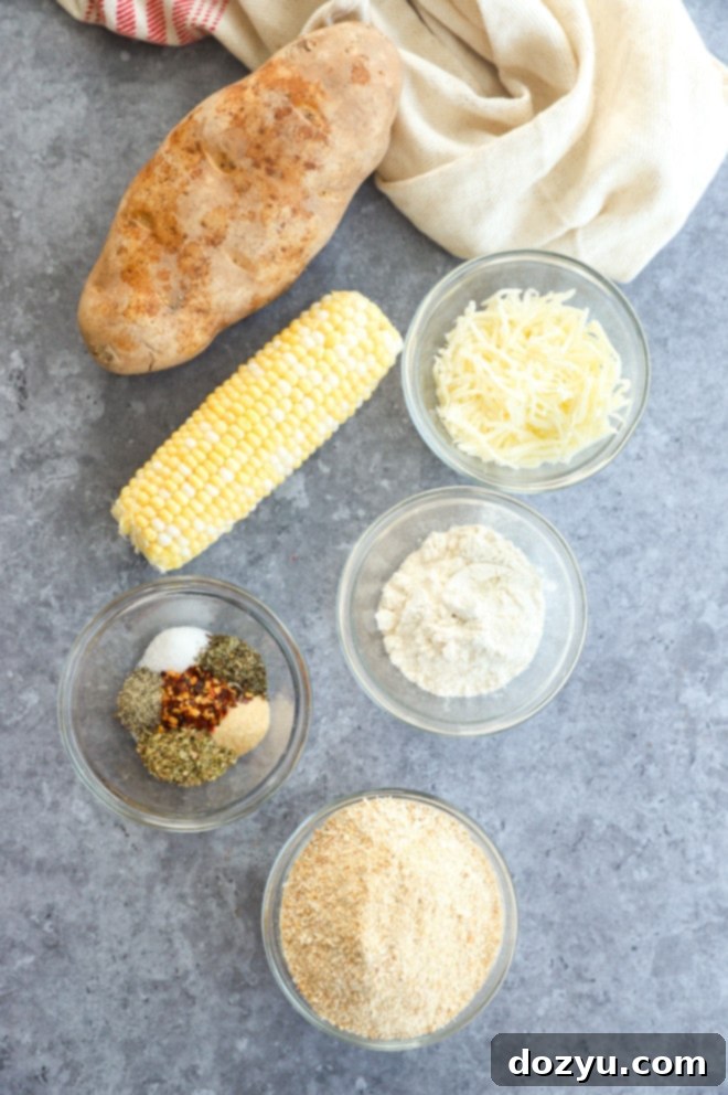 Cheesy Corn Bites 3 Assorted ingredients for cheese corn balls laid out, including corn kernels, shredded cheese, and spices.
