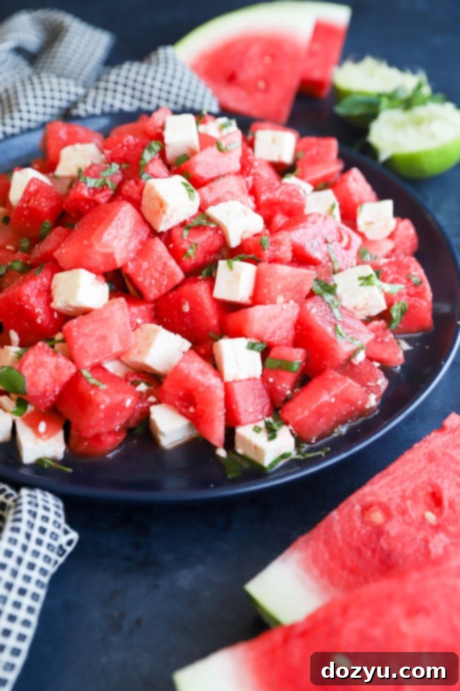 Refreshing Watermelon Feta Delight 7 A large serving plate showcasing a bountiful Watermelon Feta Salad, ready to be enjoyed as a refreshing summer dish.