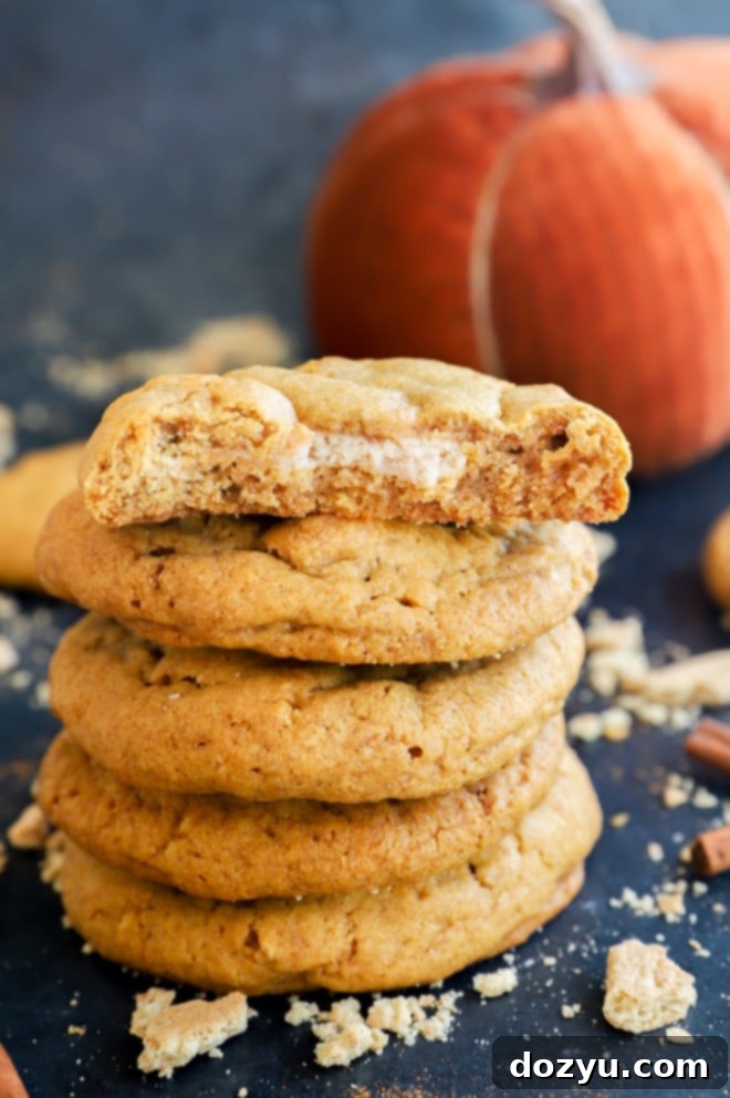 Spiced Pumpkin Cheesecake Cookies 2 Baked cookies stuffed with cream cheese and stacked up