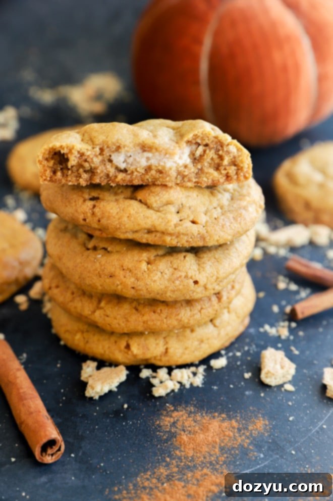 Spiced Pumpkin Cheesecake Cookies 11 Fall dessert in a stack stuffed with cream cheese