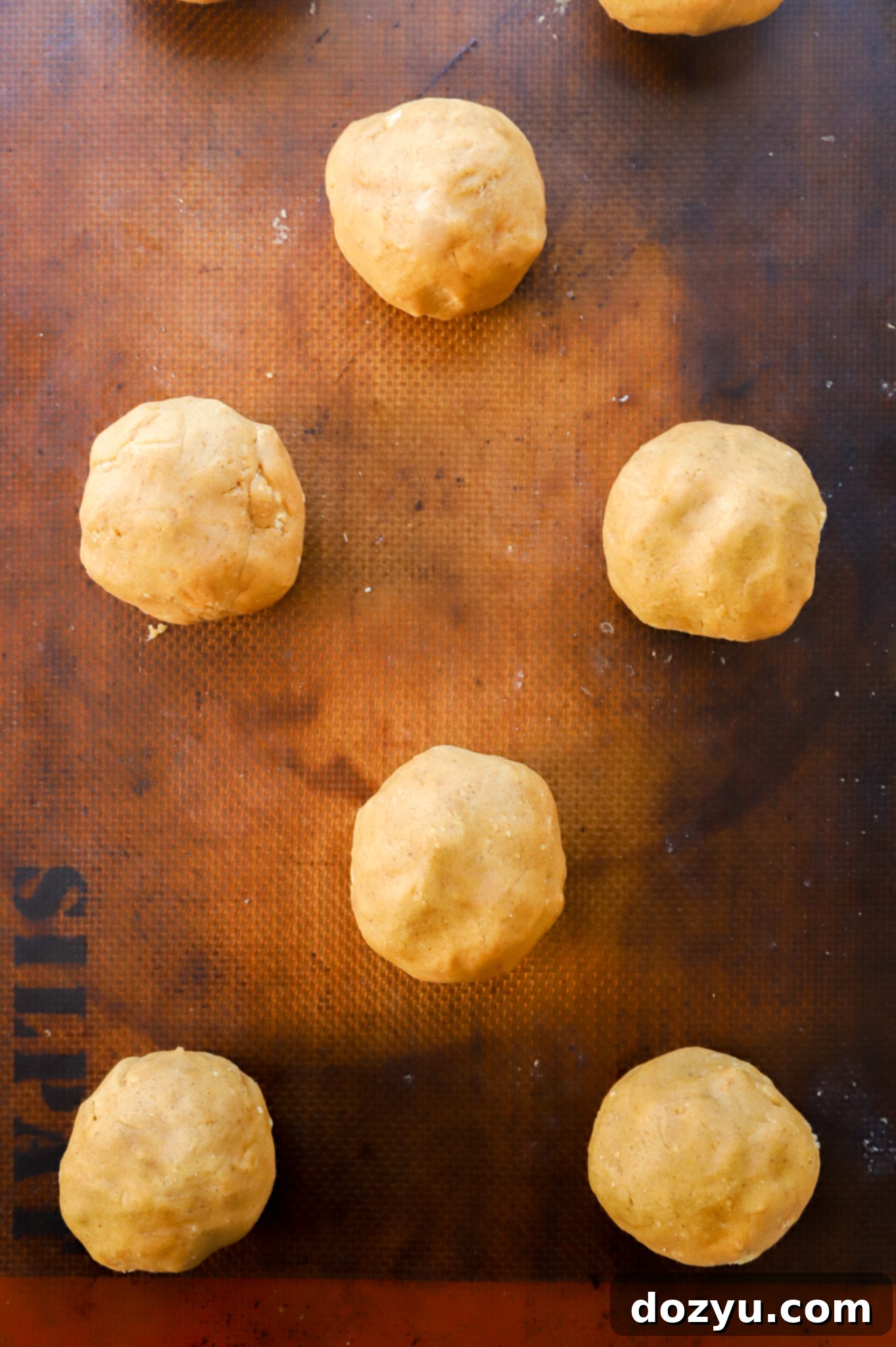 Spiced Pumpkin Cheesecake Cookies 7 pumpkin cheesecake cookie dough balls before baking