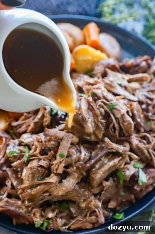 Fork-Tender Instant Pot Pot Roast 8 Pouring gravy on instant pot pot roast