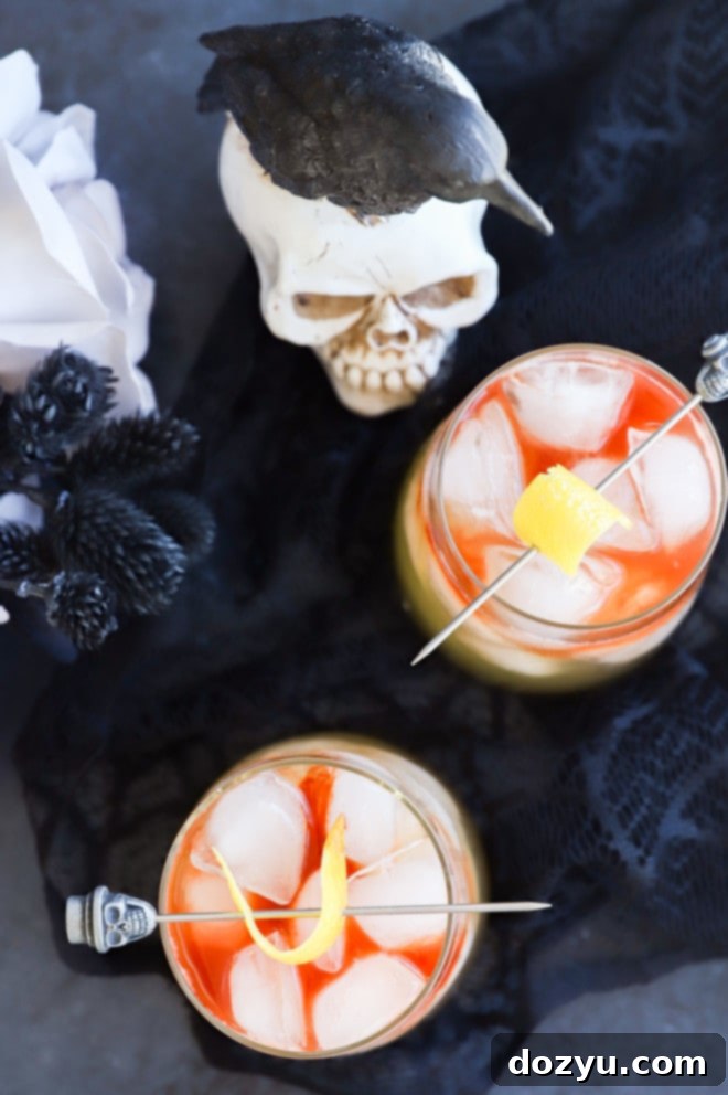 Shadow Veil Elixir 6 halloween cocktails in glasses with skull toothpicks