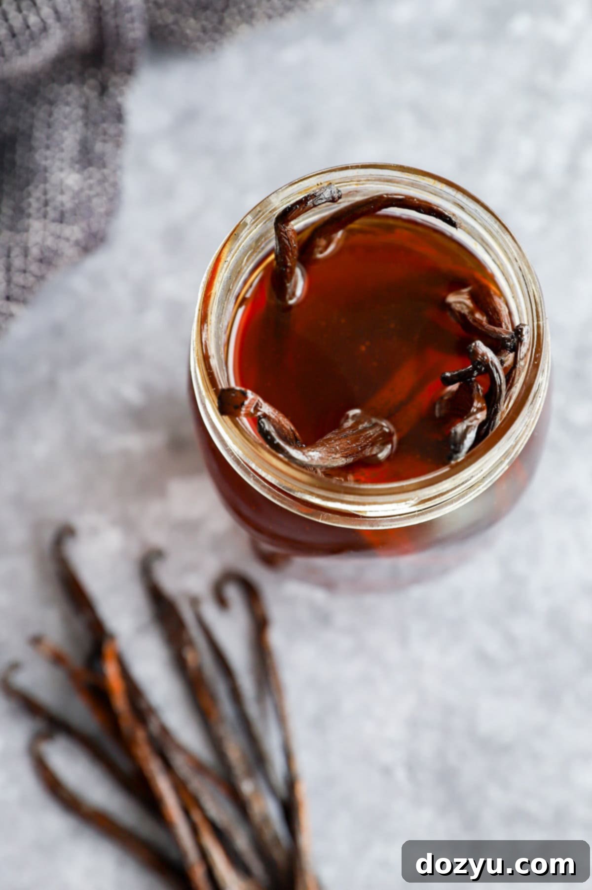 Craft Your Own Vanilla Extract 10 making homemade vanilla extract in a mason jar with whole vanilla beans