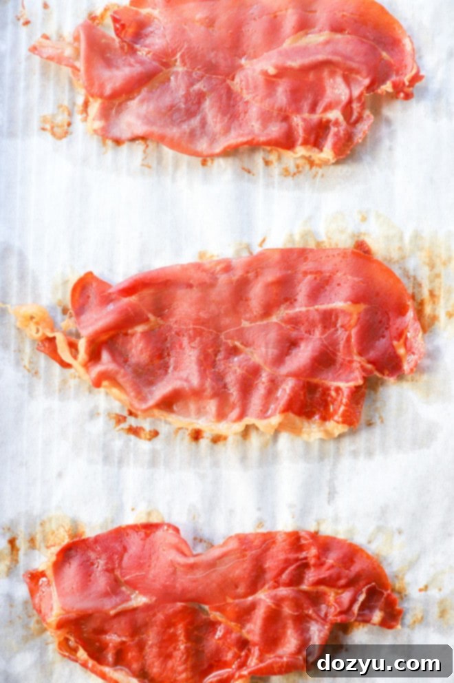 Prosciutto Crisps 4 crispy prosciutto on a baking sheet