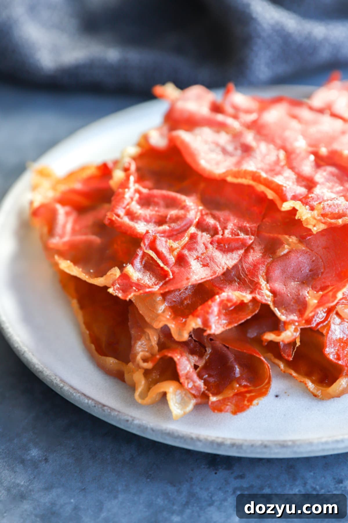 Prosciutto Crisps 8 Crispy prosciutto on a plate with napkin