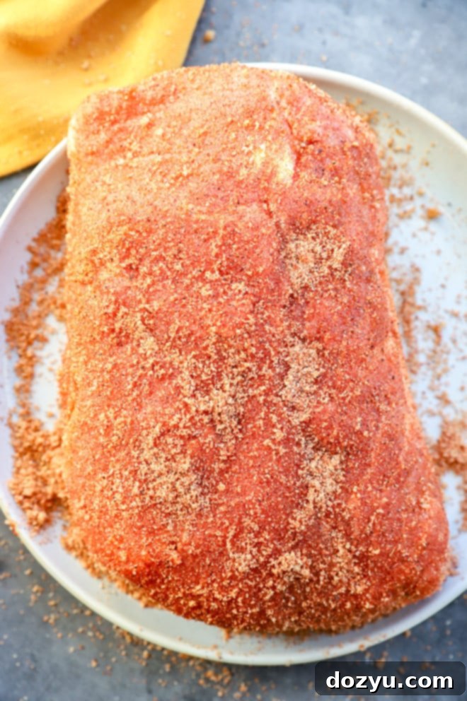 Slow-Smoked Pork Perfection 4 pork loin roast rubbed with homemade dry rub