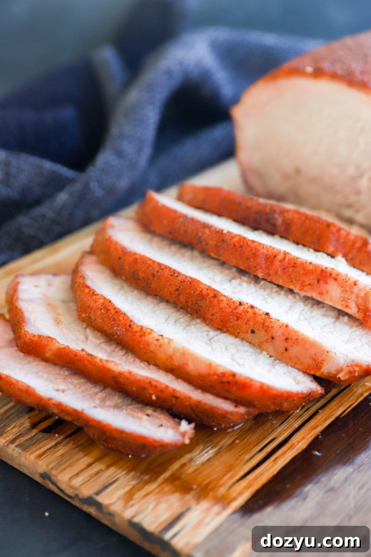 Slow-Smoked Pork Perfection 9 picture of slices of meat with dry rub