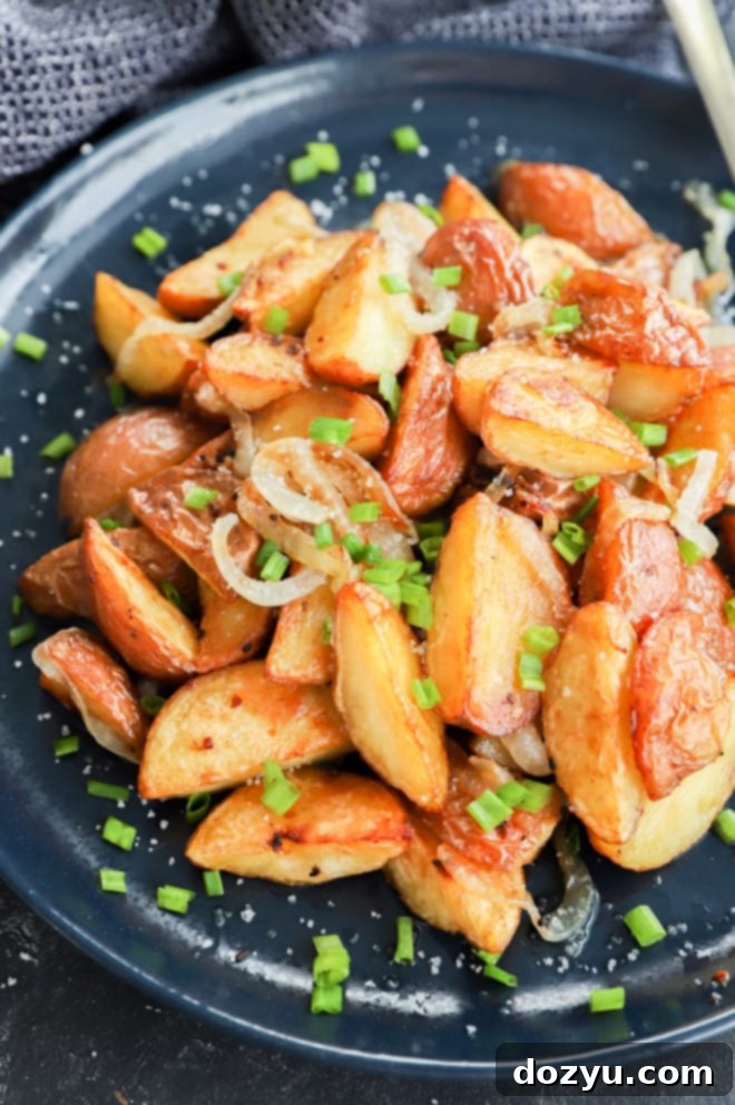 Crispy Oven Roasted Potatoes and Onions 9 easy potato side dish made in the oven and served on a plate