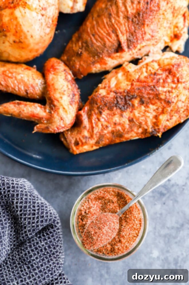 Smoked chicken on a plate with seasoning mixture