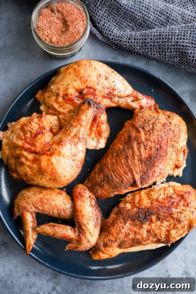 Perfectly Smoked Chicken 10 Chicken pieces on a platter with dry rub