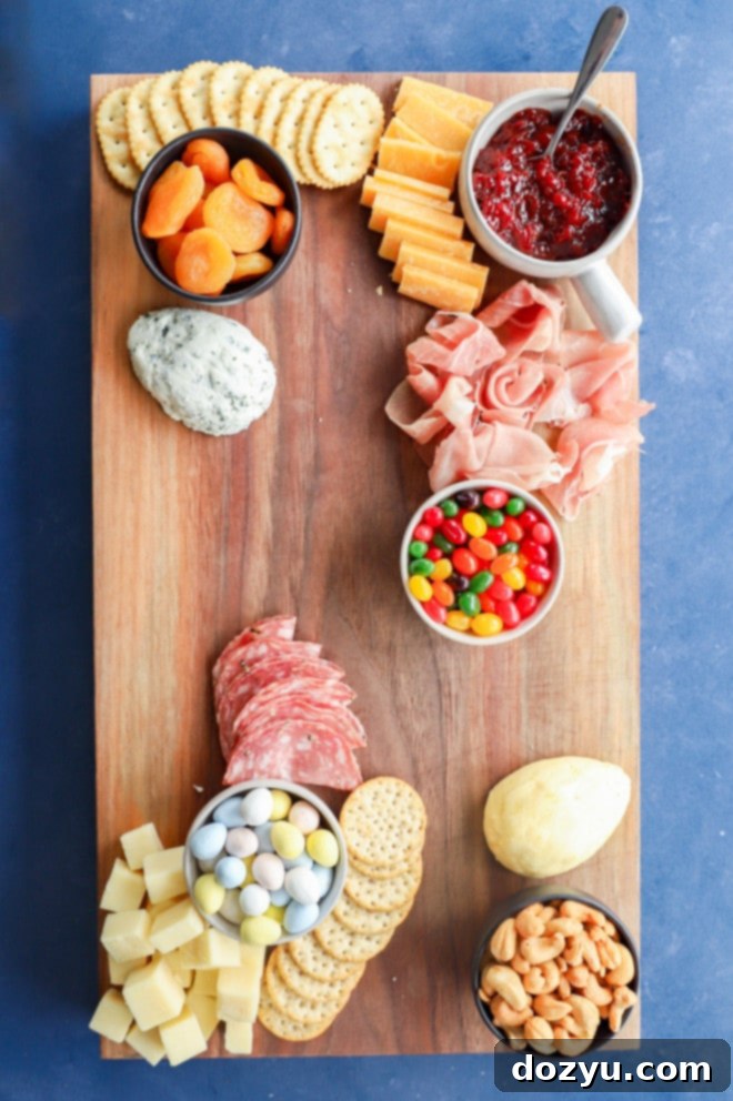 Hoppy Easter Platter 5 cheeses and meats being added to a charcuterie board