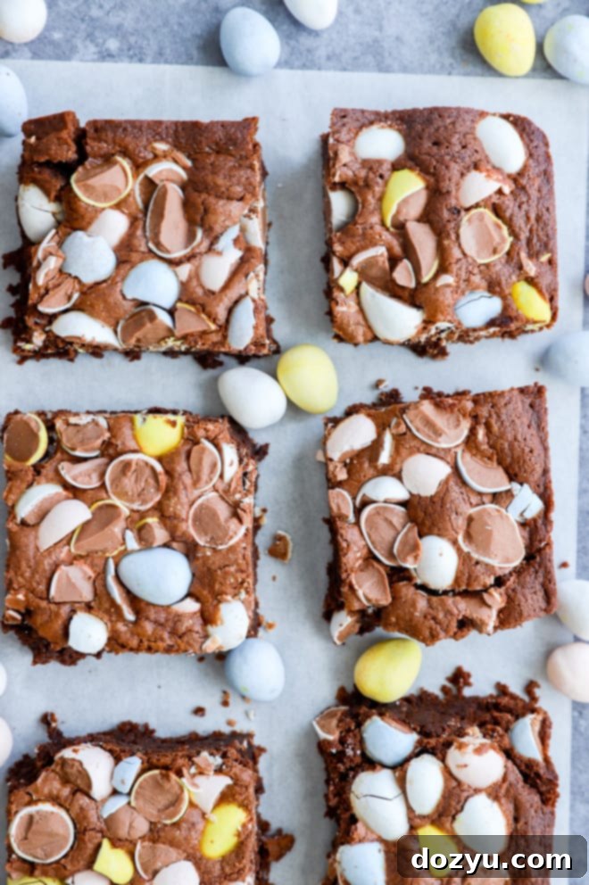 Hoppy Easter Brownies 8 easter brownies on parchment paper with mini eggs