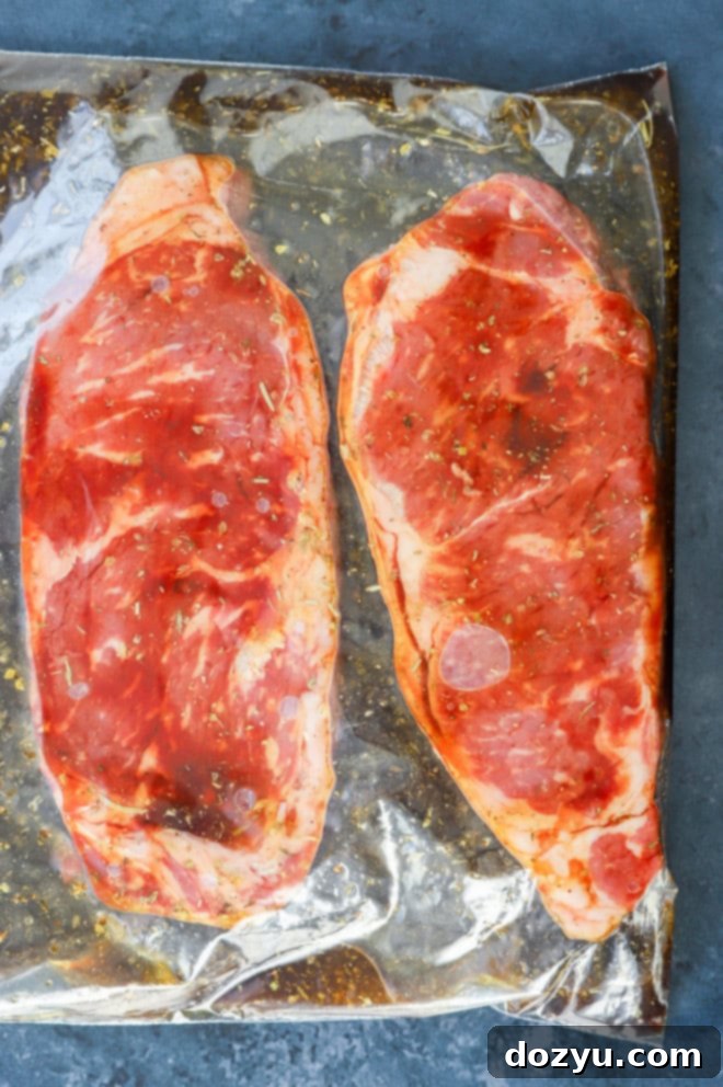 Effortless 3-Ingredient Steak Marinade 6 steaks marinating in a resealable bag