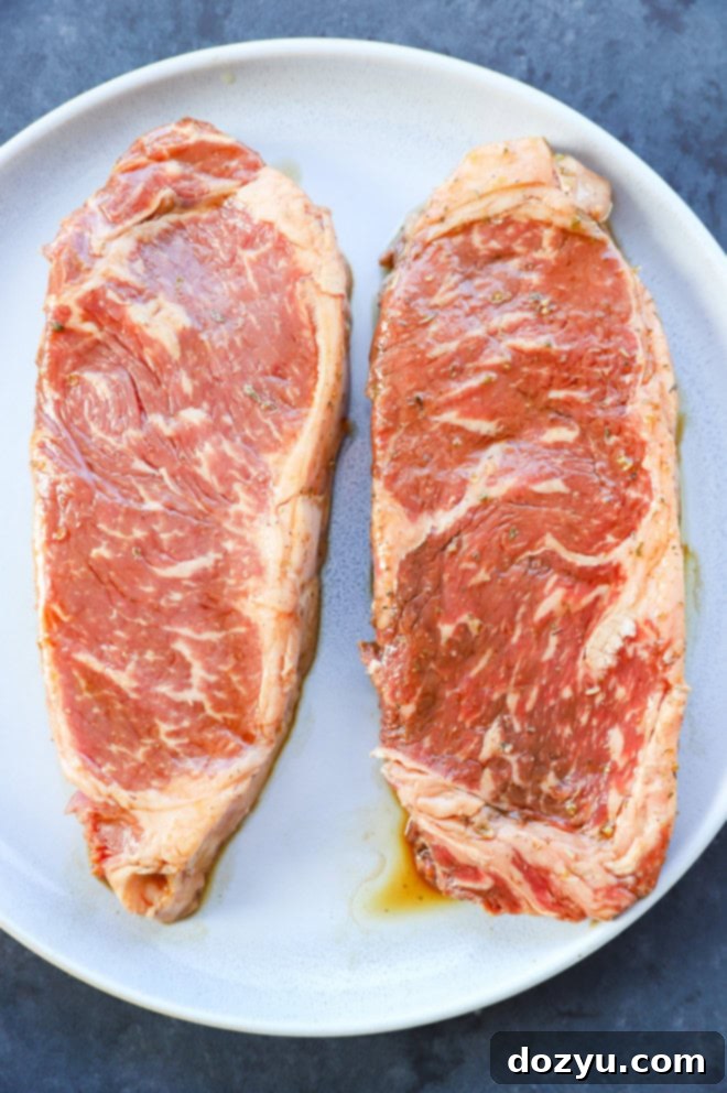 Effortless 3-Ingredient Steak Marinade 7 Marinated steaks on a plate new york strip steak