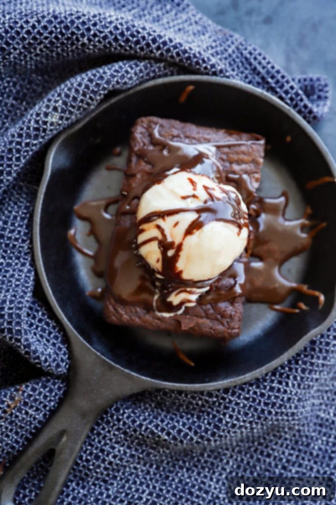 Decadent Sizzling Brownie 8 sizzling brownie in a hot skillet with ice cream and fudge sauce