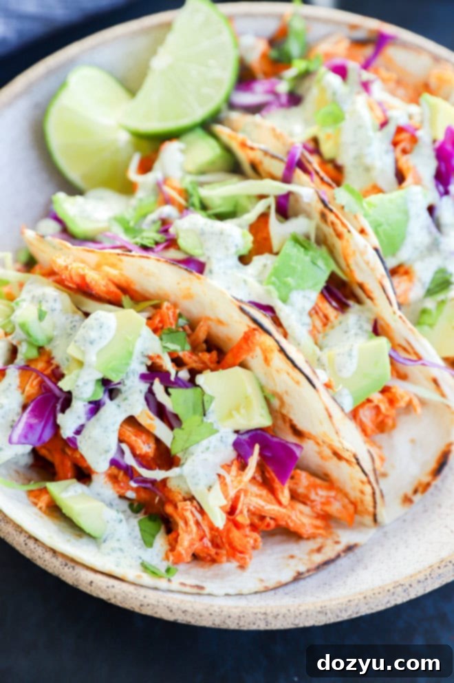 Zesty Cilantro Ranch Buffalo Chicken Tacos 8 spicy tacos with limes in the bowl