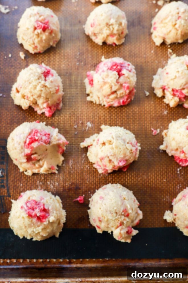 Raspberry Cheesecake Cookie Fusion 6 raw raspberry cheesecake cookie dough on baking sheet before baking in the oven