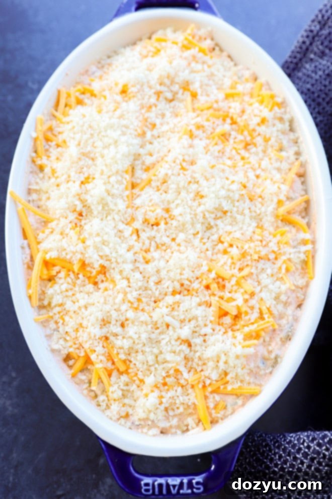 Zingy Cheesy Jalapeno Spread 5 jalapeno popper dip in a pan before baking