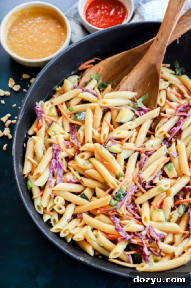 Creamy Thai Peanut Dressing 8 Bowl of noodle side dish with peanut dressing and sriracha drizzle
