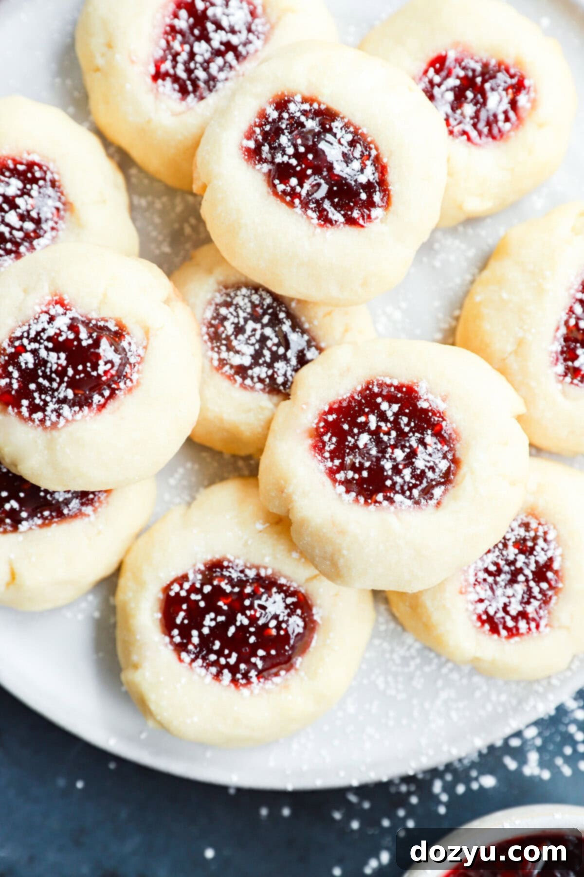 Jammy Raspberry Thumbprints 9 shortbread filled with jam and topped with powdered sugar