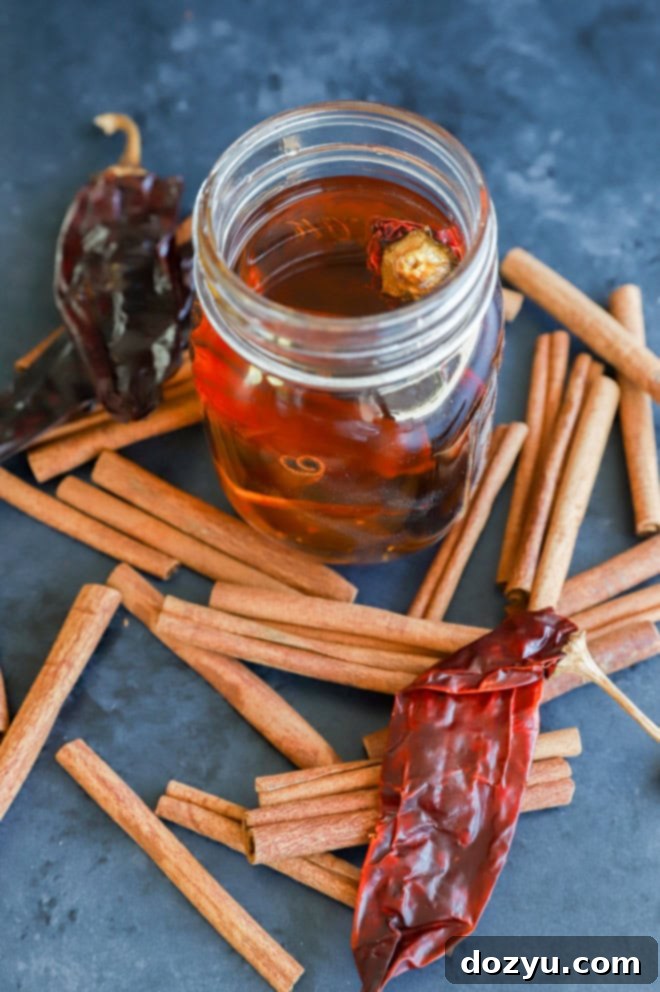 Bespoke Cinnamon Spirit 4 chile pepper and cinnamon sticks for an infused boubon in a jar