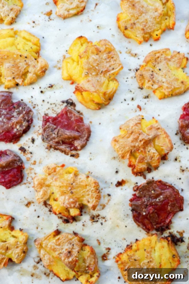 Golden Crispy Smashed Potatoes 6 smashed potatoes on a baking sheet after baking