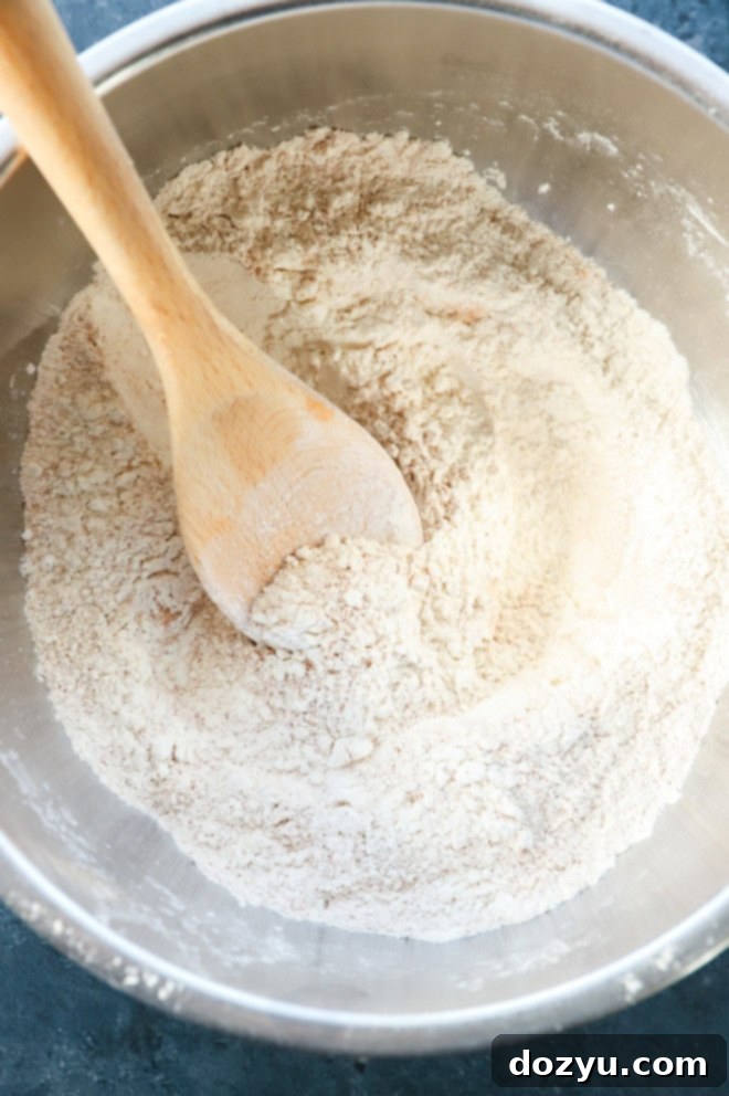 Spiced Pumpkin Banana Muffins 6 dry ingredients in bowl with wooden spoon