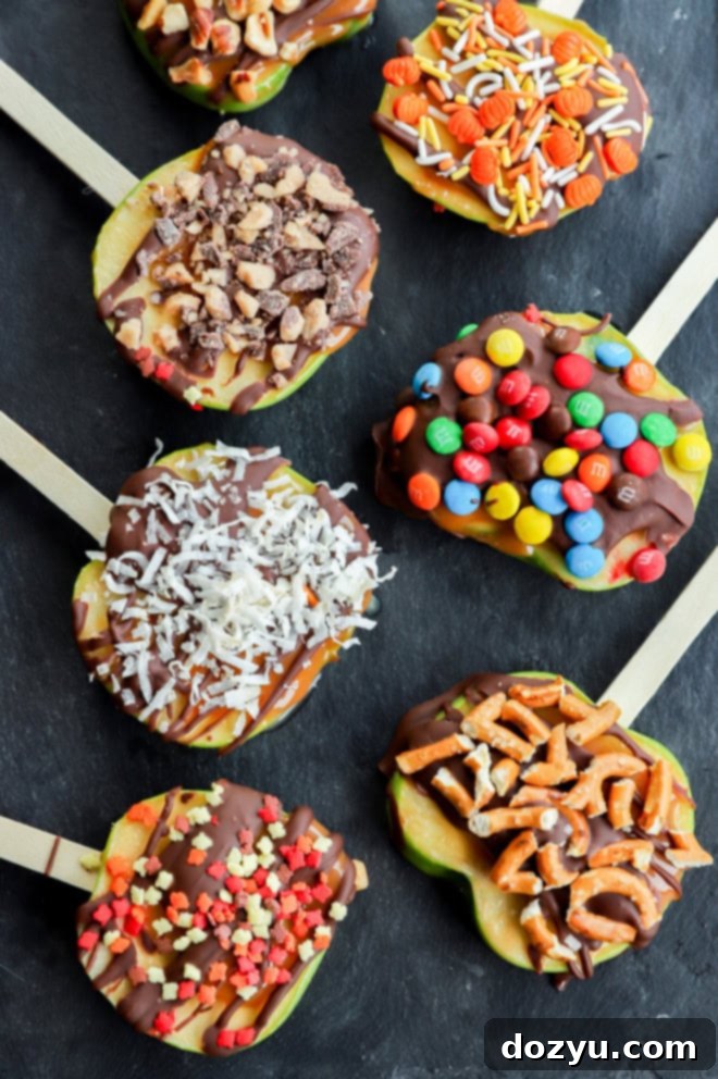 Crisp Candy Apple Treats 2 line of sliced fruit with chocolate caramel and other toppings