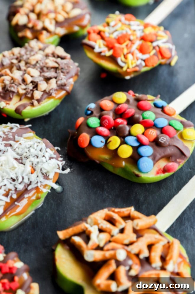 Crisp Candy Apple Treats 6 sliced fruit on slate platter with candies on top