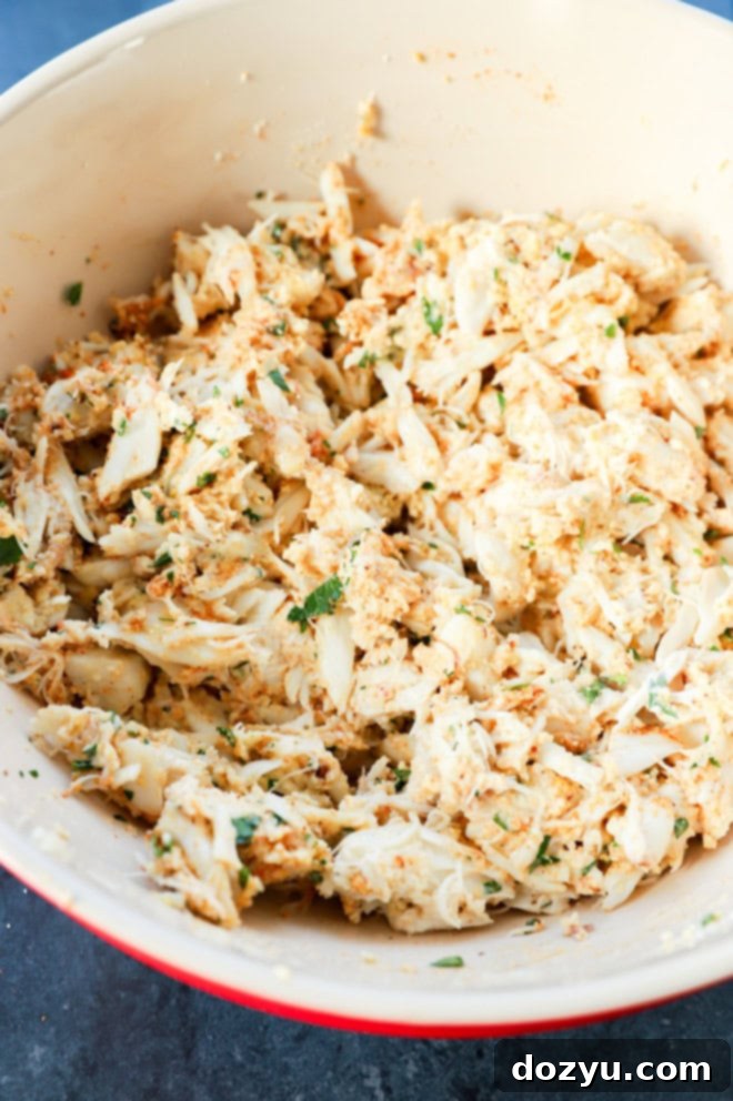 Golden Baked Crab Cakes 5 mixture in a bowl mixed together