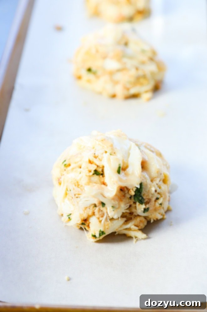 Golden Baked Crab Cakes 6 baked crab cakes brushed with butter before baking