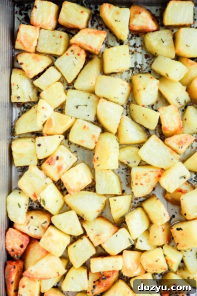 Golden French Potato Bake 5 roasted root vegetables in a pan with fresh herbs