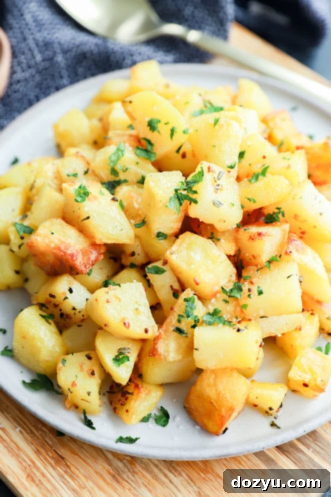 Golden French Potato Bake 6 platter of golden potato cubes on platter with gold spoon
