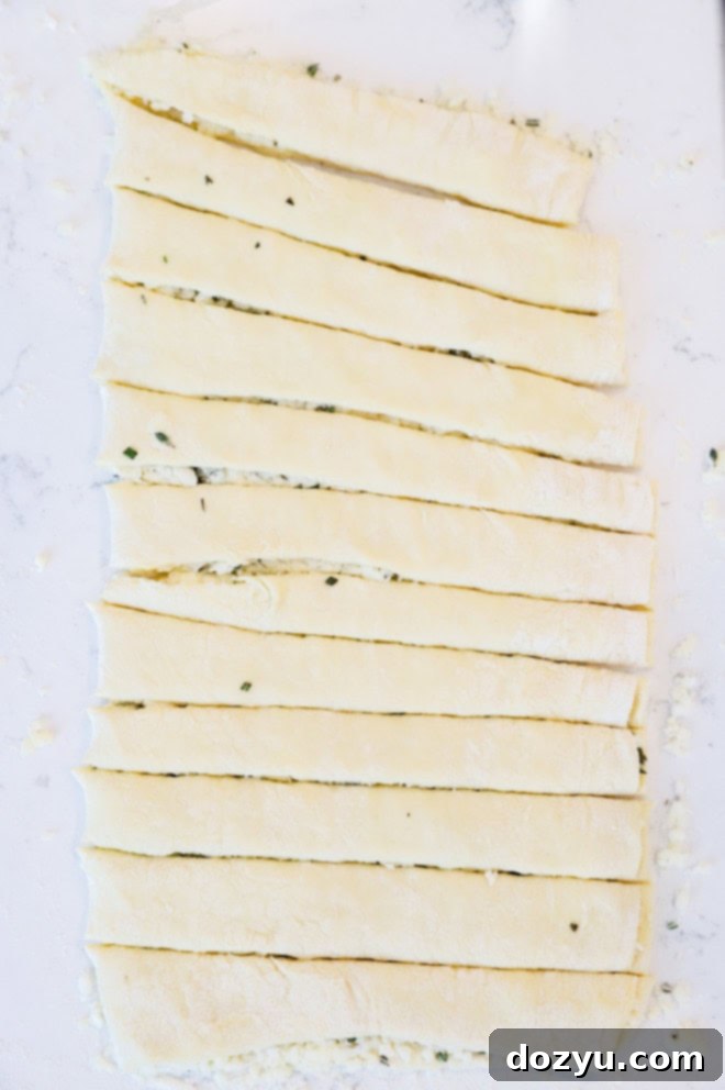 Savory Prosciutto Swirls 4 making cheese twists dough cut into strips